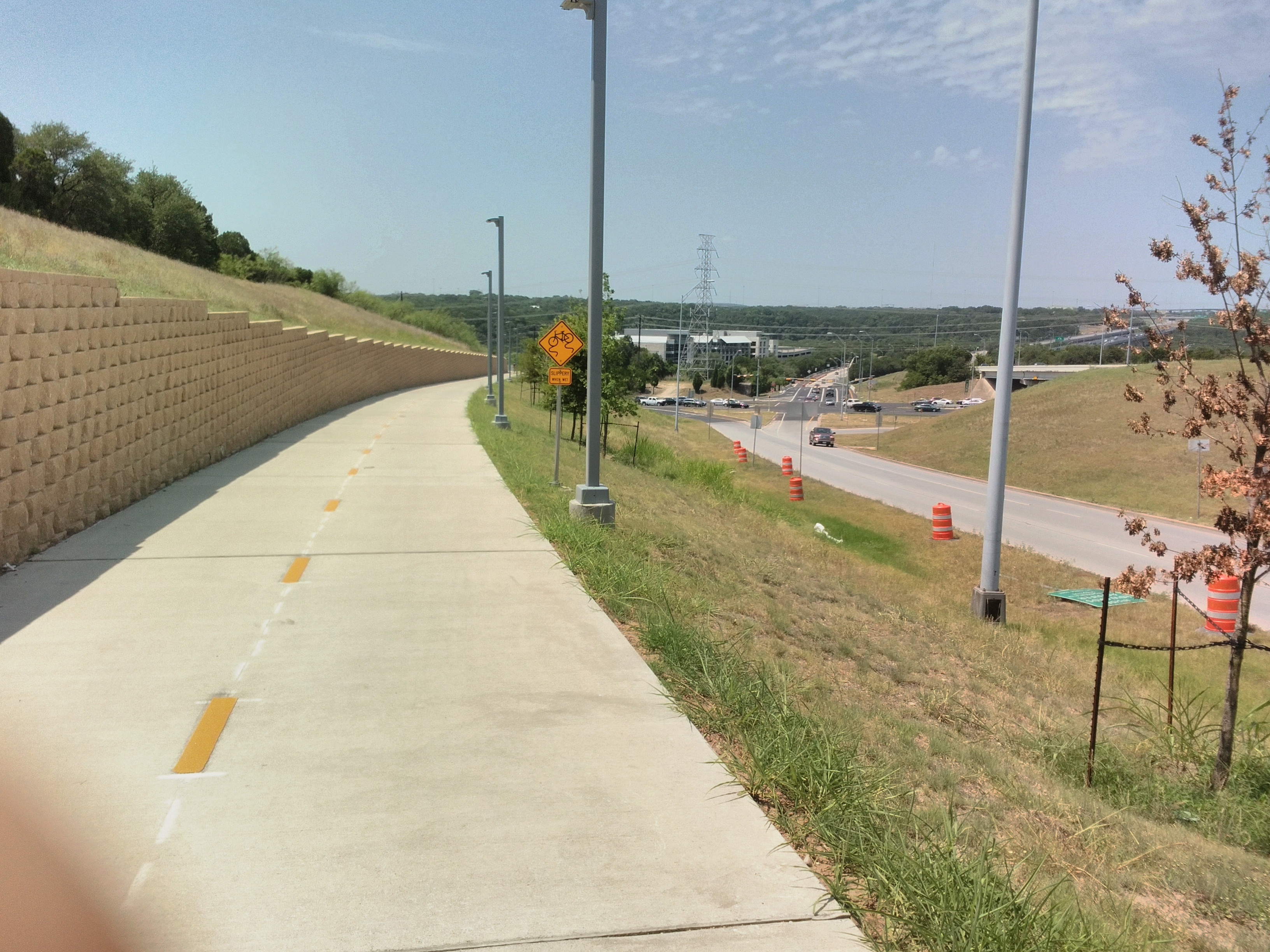Descending the hill toward the Loop 360 interchange. This segment is very well-lit. (Sorry for covering the camera.)